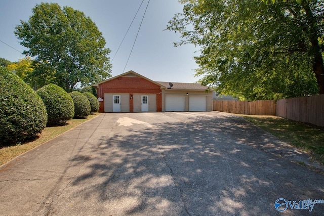 garage with fence