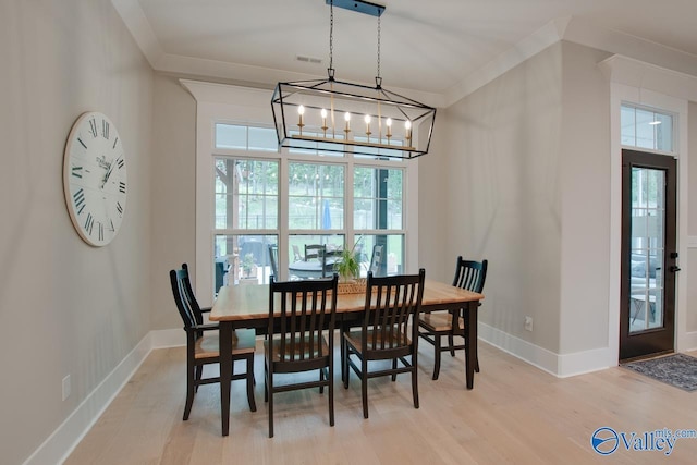 8076 Goose Ridge Dr, Owens Cross Roads, AL 35763 - dining space with light wood-style floors, a chandelier, and baseboards