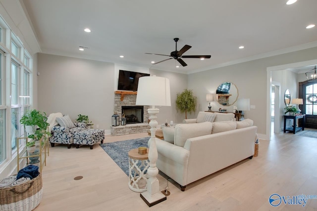 8076 Goose Ridge Dr, Owens Cross Roads, AL 35763 - living room with a fireplace, ceiling fan, light wood-style flooring, recessed lighting, and baseboards
