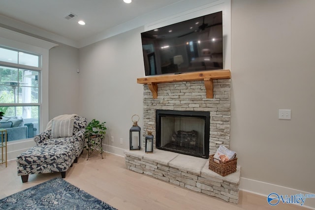 8076 Goose Ridge Dr, Owens Cross Roads, AL 35763 - living room with wood finished floors, a fireplace, recessed lighting, baseboards, and ornamental molding