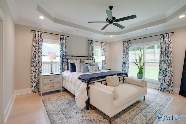 8076 Goose Ridge Dr, Owens Cross Roads, AL 35763 - bedroom featuring a tray ceiling, light wood finished floors, recessed lighting, baseboards, and ceiling fan