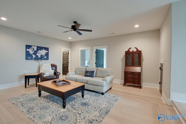 8076 Goose Ridge Dr, Owens Cross Roads, AL 35763 - living area with ceiling fan, recessed lighting, light wood-style floors, and baseboards