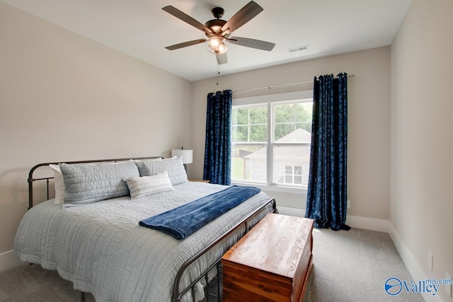 8076 Goose Ridge Dr, Owens Cross Roads, AL 35763 - carpeted bedroom featuring baseboards and a ceiling fan