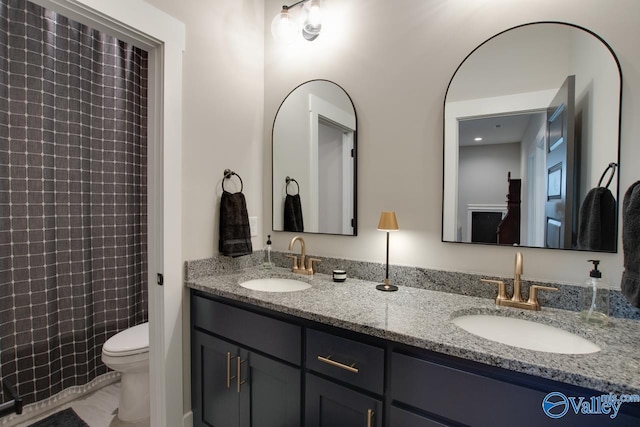 8076 Goose Ridge Dr, Owens Cross Roads, AL 35763 - full bathroom featuring double vanity and toilet