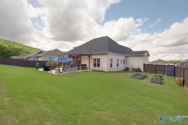 8076 Goose Ridge Dr, Owens Cross Roads, AL 35763 - rear view of property with a vegetable garden, a patio, a pergola, brick siding, and a hot tub