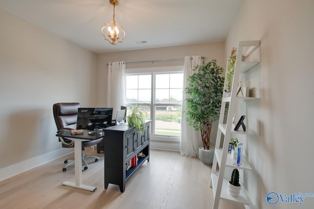8076 Goose Ridge Dr, Owens Cross Roads, AL 35763 - office area with light wood-style flooring, a chandelier, and baseboards