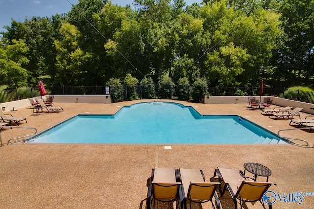 view of swimming pool featuring a patio area