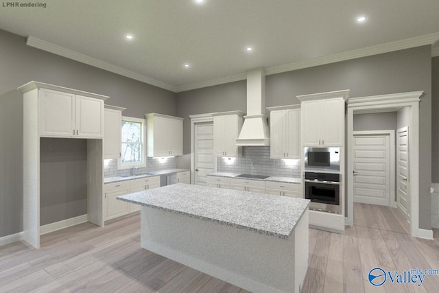 kitchen featuring white cabinetry, stainless steel oven, a kitchen island, black electric stovetop, and light stone countertops