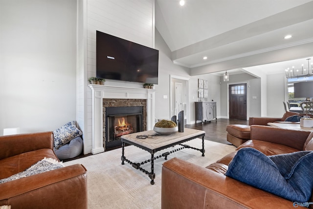 living room with a fireplace, vaulted ceiling, light wood finished floors, and recessed lighting