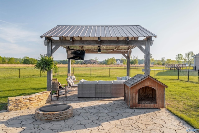 view of patio / terrace featuring a gazebo, fence, and an outdoor living space with a fire pit