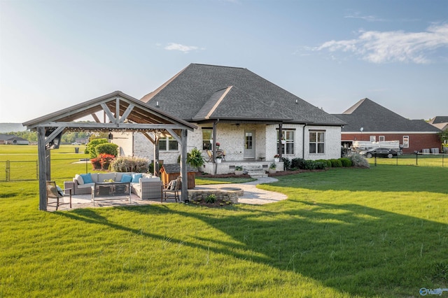rear view of house featuring a fenced backyard, a gazebo, a lawn, a shingled roof, and an outdoor living space