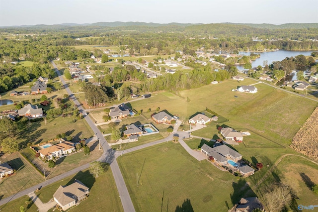bird's eye view featuring a residential view, a view of trees, and a water view