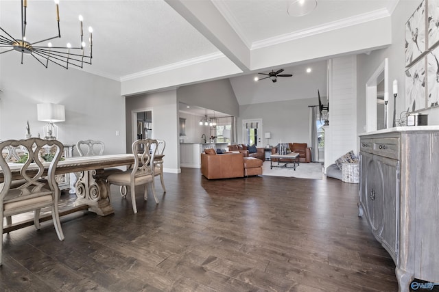 interior space featuring lofted ceiling, dark wood-style floors, ornamental molding, baseboards, and ceiling fan with notable chandelier