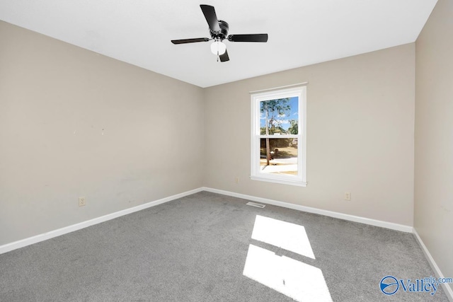 carpeted empty room with ceiling fan