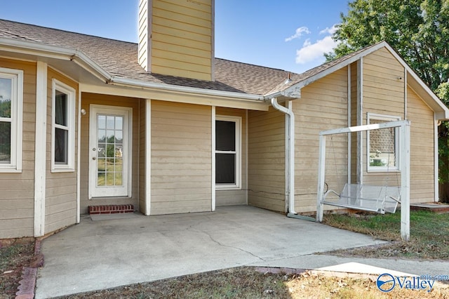 doorway to property with a patio