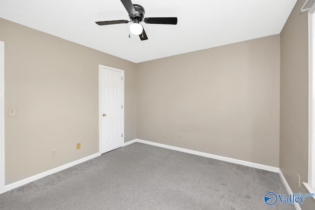 carpeted empty room with ceiling fan