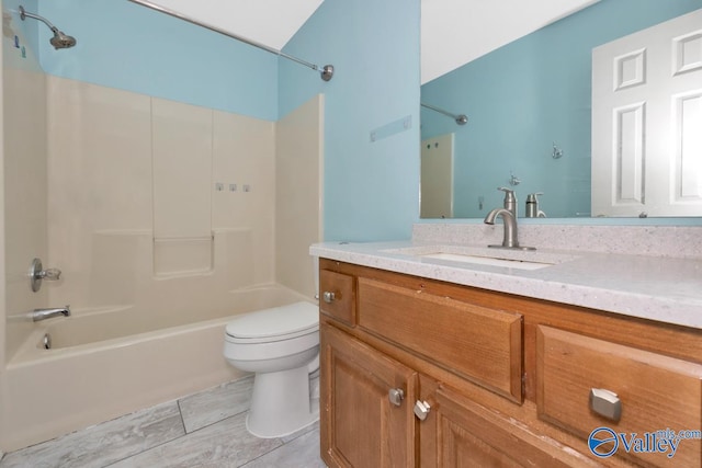 full bathroom with tile patterned flooring, washtub / shower combination, vanity, and toilet