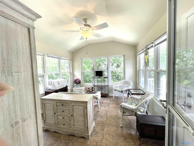 sunroom / solarium featuring a ceiling fan and lofted ceiling
