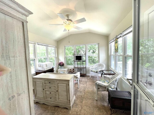 sunroom featuring ceiling fan and vaulted ceiling