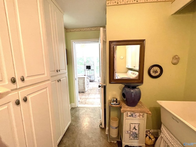 hallway featuring washer / dryer