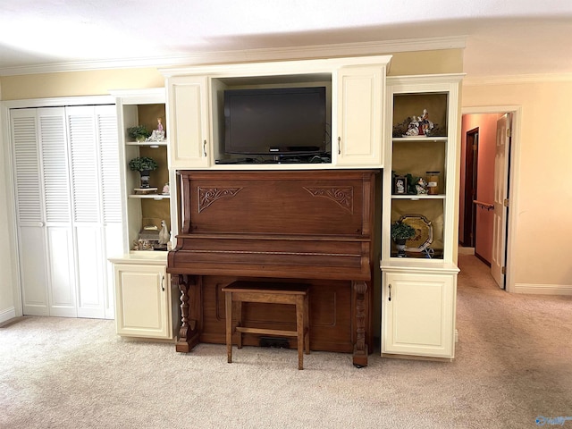 living area with light carpet, baseboards, and crown molding