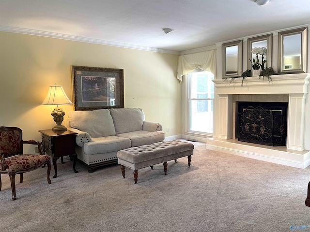 carpeted living room with a fireplace with raised hearth and crown molding