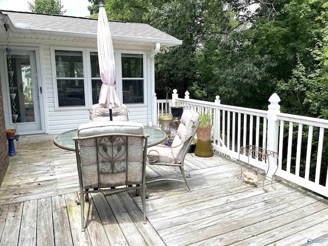 wooden deck with outdoor dining space