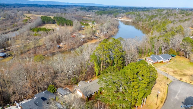 aerial view featuring a water view and a wooded view