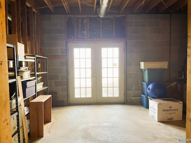 below grade area with concrete block wall and french doors