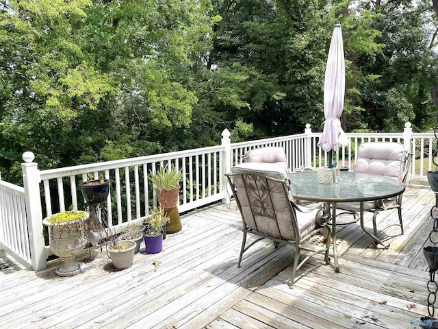 wooden deck with outdoor dining space