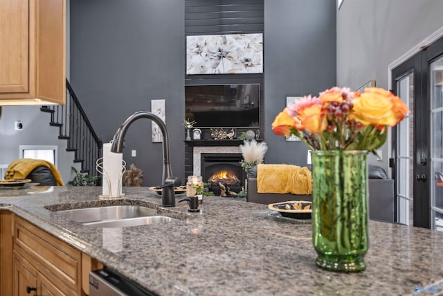 kitchen featuring sink and stone countertops