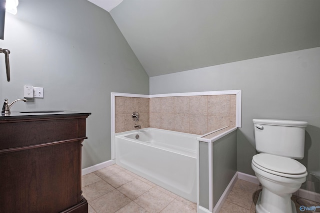 bathroom with a washtub, tile patterned floors, toilet, and lofted ceiling