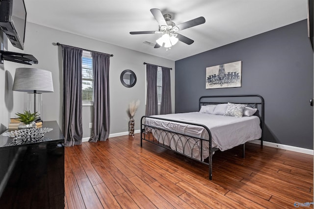 bedroom featuring hardwood / wood-style flooring and ceiling fan