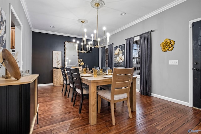 dining area featuring a chandelier, dark wood-type flooring, and ornamental molding