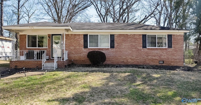 view of front of house featuring a porch, a front yard, crawl space, and brick siding