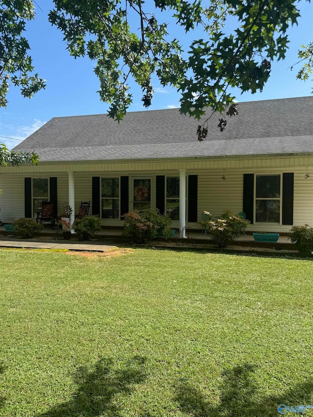 back of house with a yard