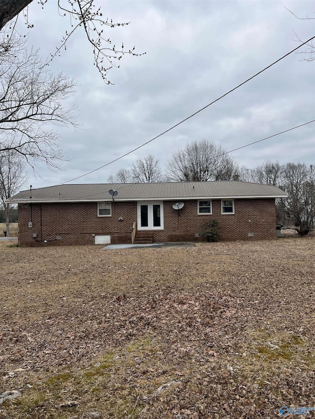 back of property featuring a patio area