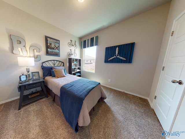 carpeted bedroom featuring lofted ceiling