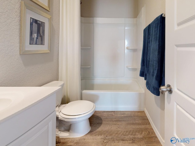 full bathroom with vanity, hardwood / wood-style floors, shower / tub combo with curtain, and toilet