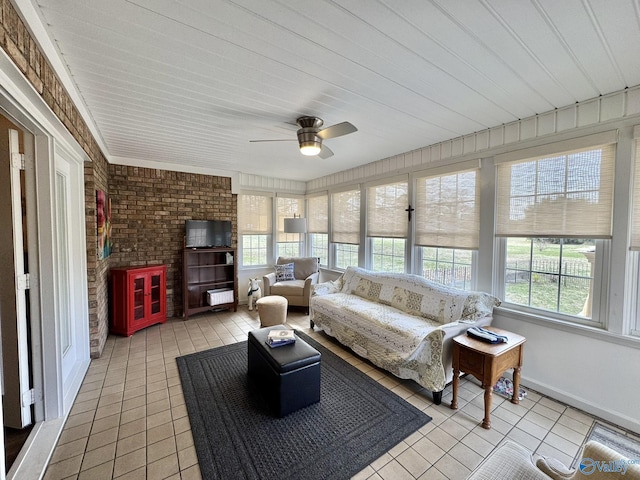 sunroom with plenty of natural light and ceiling fan