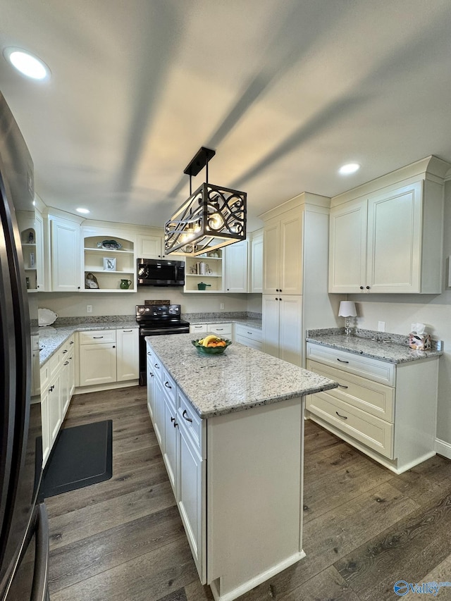 kitchen with white cabinetry, electric range, a center island, decorative light fixtures, and dark hardwood / wood-style floors