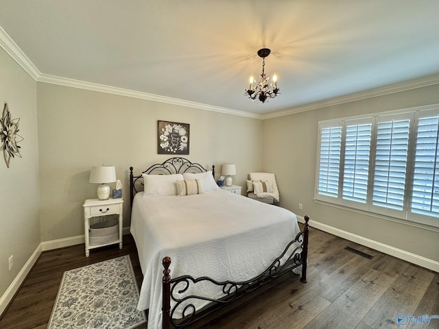 bedroom with dark hardwood / wood-style flooring, crown molding, and a notable chandelier