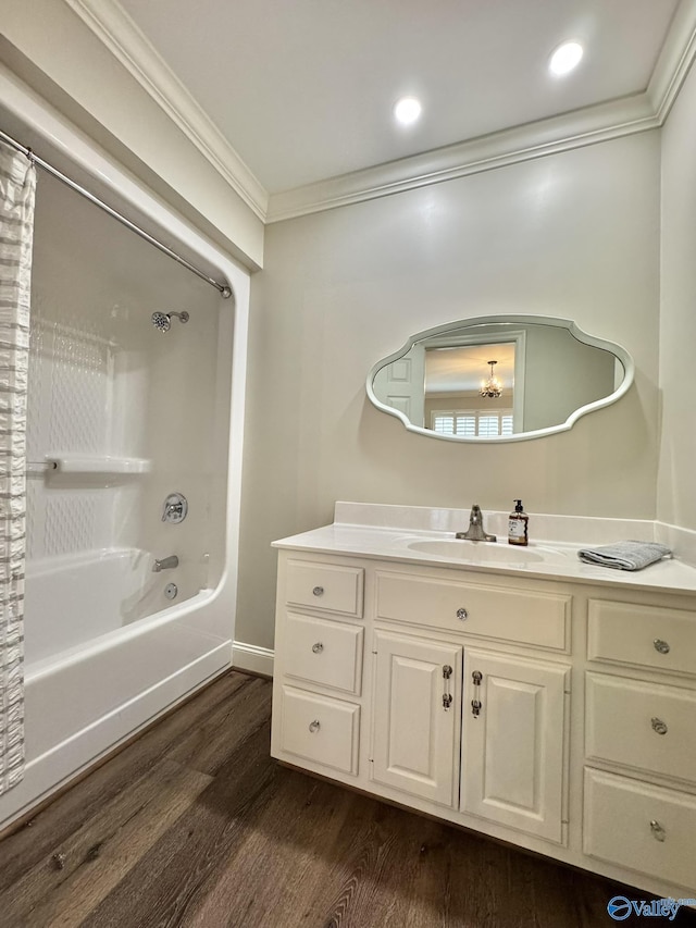 bathroom featuring wood-type flooring, shower / bathtub combination with curtain, crown molding, and vanity