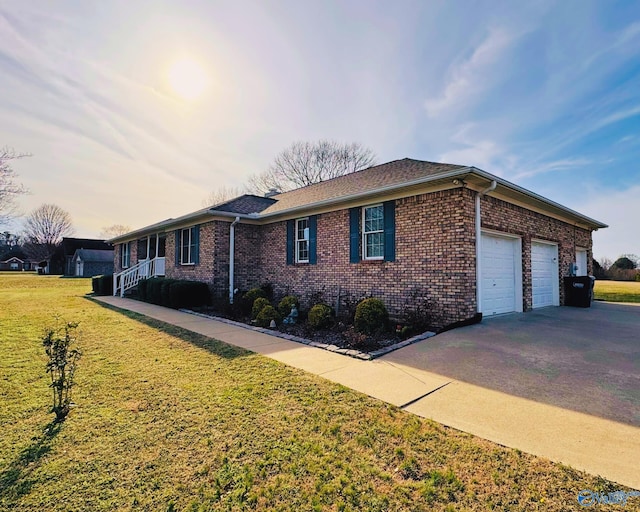 view of property exterior with a garage and a yard