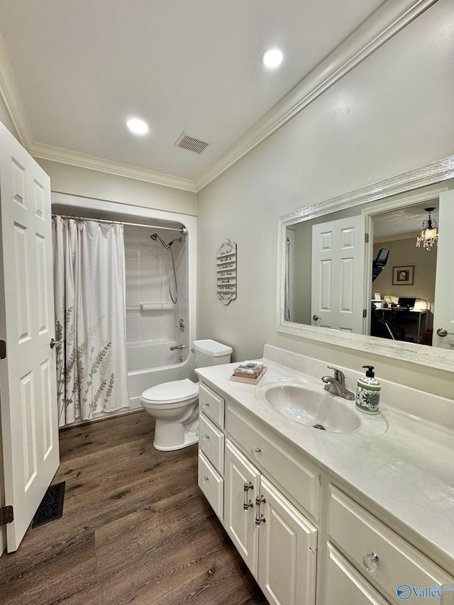 full bathroom featuring ornamental molding, shower / tub combo, hardwood / wood-style flooring, and vanity