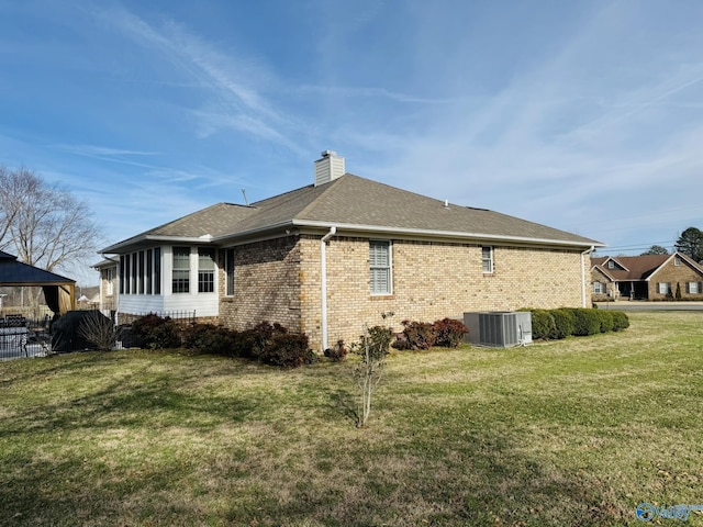 view of property exterior with a lawn and central air condition unit