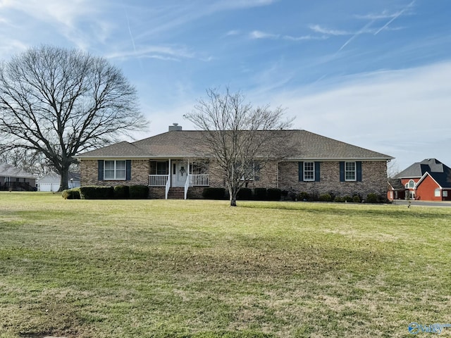 single story home featuring a porch and a front yard