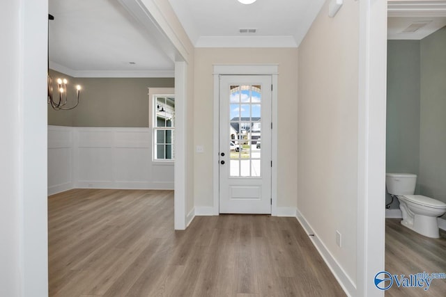 4 Sable Creek Ct, Gurley, AL 35748 - entrance foyer with visible vents, wood finished floors, and an inviting chandelier