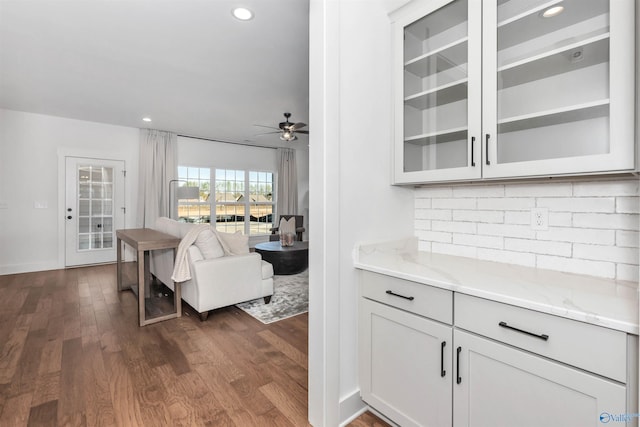 dining space featuring dark hardwood / wood-style flooring and ceiling fan