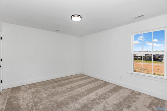 unfurnished room featuring carpet flooring